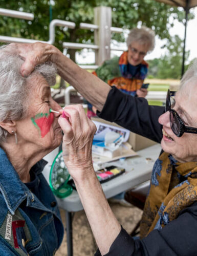 woman getting face painted